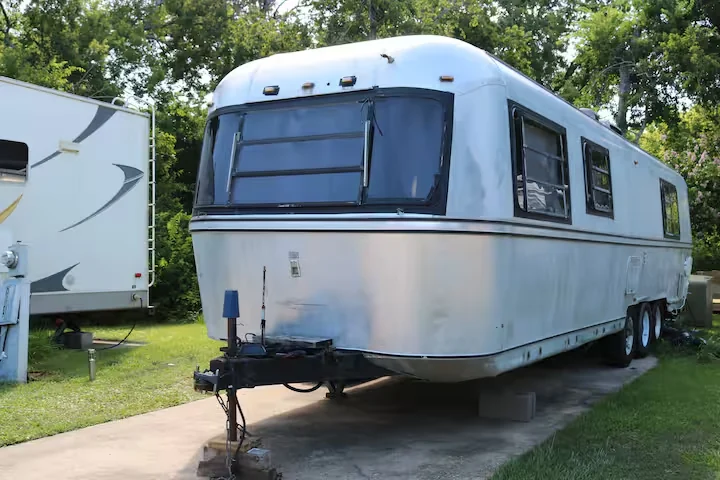 The silver Avion travel trailer, photographed from the front